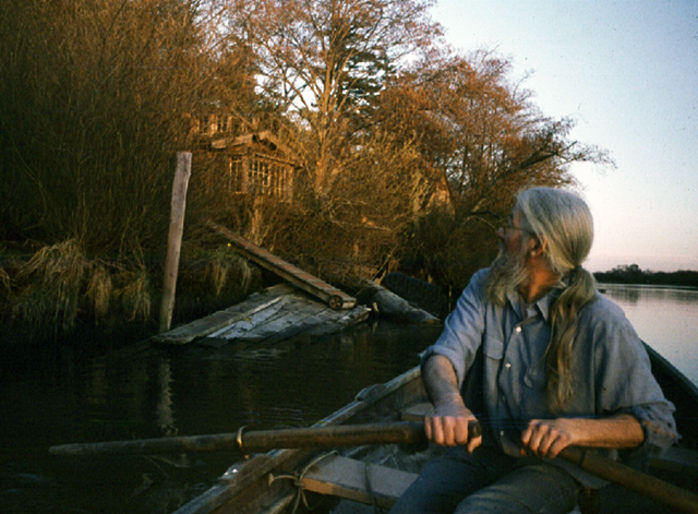 Robert Sund rowing near Bo Miller's shack